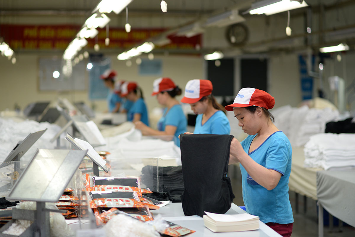 Employees are at work at an apparel facility. Vietnam posted US$1.64 billion in trade surplus between January and February